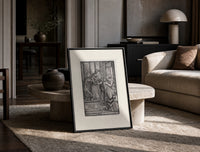 Death and two noblewomen print in a black frame leaning on a travertine table in a sunlit lounge
