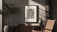 Death and clergyman woodcut scene poster framed above a fluted sideboard beside an olive tree