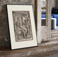 Death visiting seated nobleman print in a black frame leaning beside a vintage door on parquet