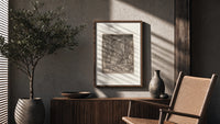 Death crowning enthroned king poster framed above a fluted sideboard beside an olive tree