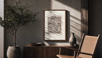 Death dancing with empress poster framed above a fluted sideboard beside an olive tree