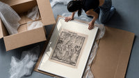 Death dancing with empress framed print being unpacked from protective bubble wrap and a box