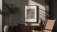 Death fighting armored nobleman poster framed above a fluted sideboard beside an olive tree