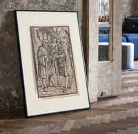 Death confronts man, Dance of Death print in a black frame leaning beside a vintage door on parquet