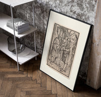 Death confronts man, Dance of Death poster in a black frame leaning beside a shelf in a raw-plaster loft