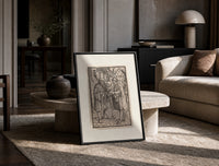 Death confronts man, Dance of Death print in a black frame leaning on a travertine table in a sunlit lounge