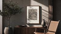 Death seizing merchant among cargo bales poster framed above a fluted sideboard beside an olive tree