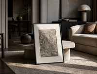 Death leading an old bearded man print in a black frame leaning on a travertine table in a sunlit lounge