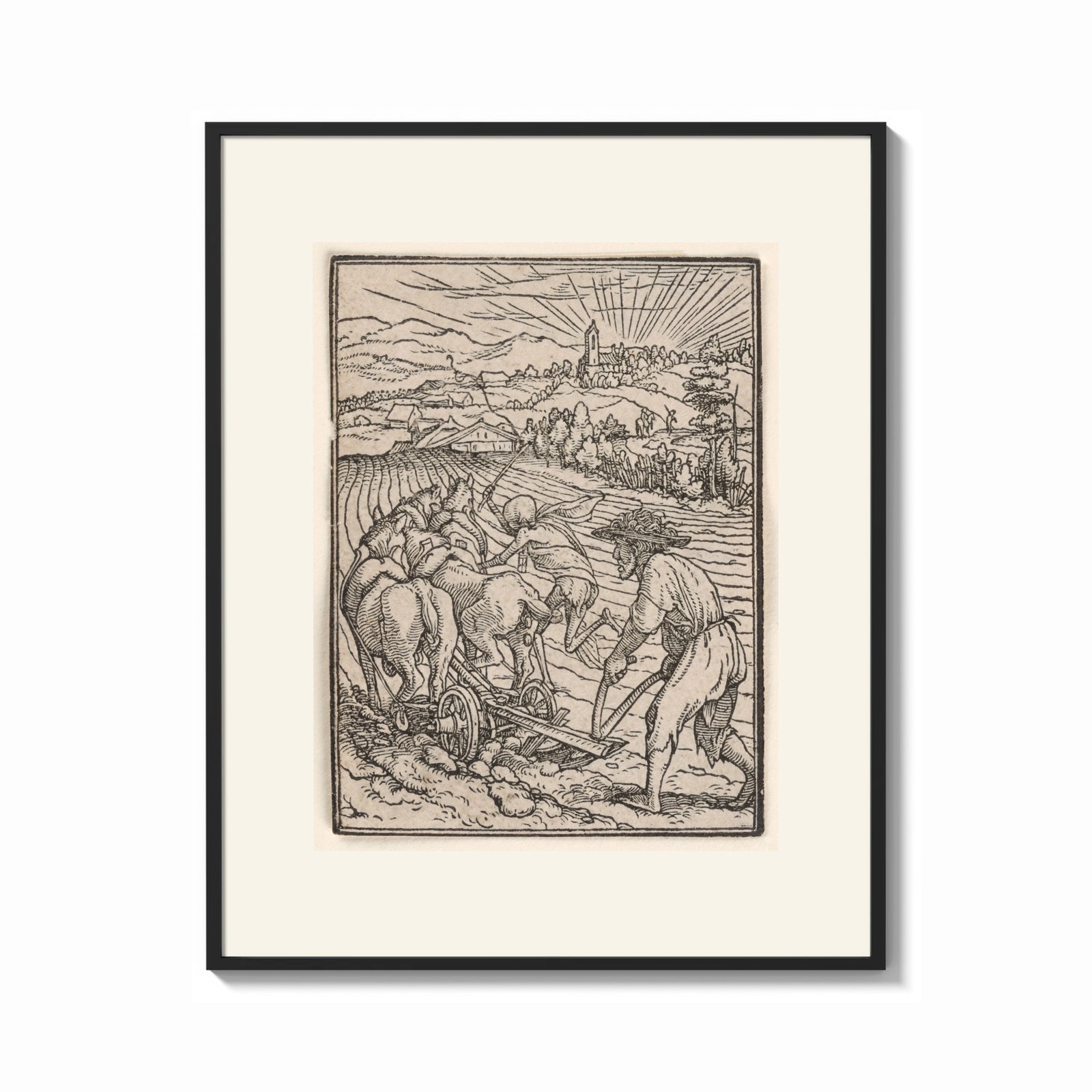 Framed Death plowing field with farmer print shown as a bold statement piece on a clean gallery wall