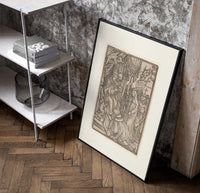 Death visits the Pope crowning emperor poster in a black frame leaning beside a shelf in a raw-plaster loft