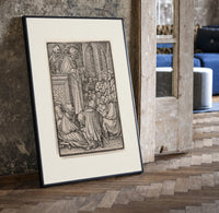 Preacher and death with congregation print in a black frame leaning beside a vintage door on parquet