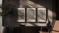 Death visits people in three scenes triptych in three walnut frames above a sideboard in a warm room