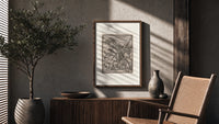 Peasant carrying load with Death skeleton poster framed above a fluted sideboard beside an olive tree