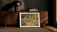 Four robed figures gathered around a table print in a black frame leaning against a walnut console in lamplight