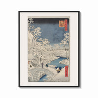 Framed Hiroshige Meguro Bridge in Snow print shown as a bold statement piece on a clean gallery wall