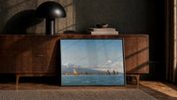 Mediterranean coastal scene with a volcano and sailboats vintage art print print in a black frame leaning against a…