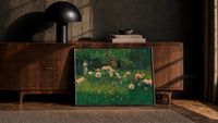 woman reading among roses vintage art print print in a black frame leaning against a walnut console in lamplight