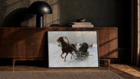 horse-drawn sledge racing through snow vintage art print print in a black frame leaning against a walnut console in lamplight