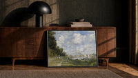 riverside park with sailboats vintage art print print in a black frame leaning against a walnut console in lamplight