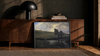 rolling hills, pond, and windswept trees under dramatic clou vintage art print print in a black frame leaning against a…