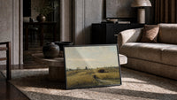harvest field with a gleaning woman and hay wagon vintage art print print in a slim black frame leaning on a travertine…