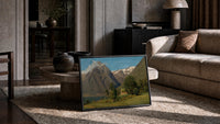 Norwegian fjord and mountain lake landscape vintage art print print in a slim black frame leaning on a travertine coffee…
