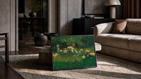 woman reading among roses vintage art print print in a slim black frame leaning on a travertine coffee table