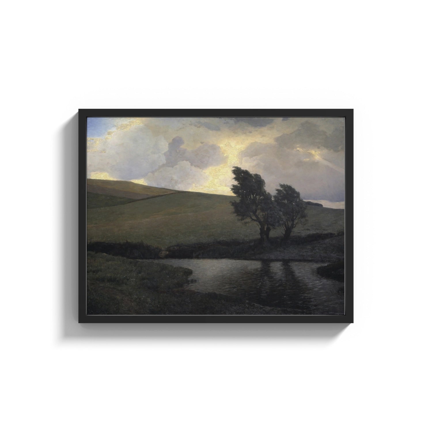 Framed rolling hills, pond, and windswept trees under dramatic clou vintage art print print shown as a wide statement…
