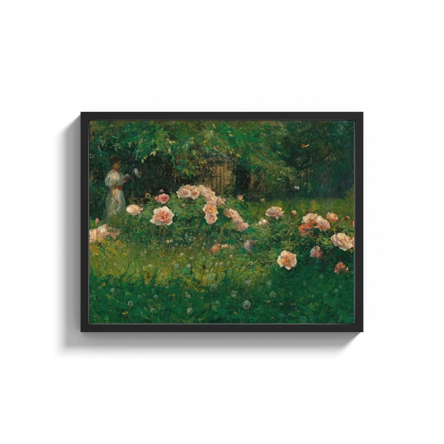 Framed woman reading among roses vintage art print print shown as a wide statement piece on a clean white wall