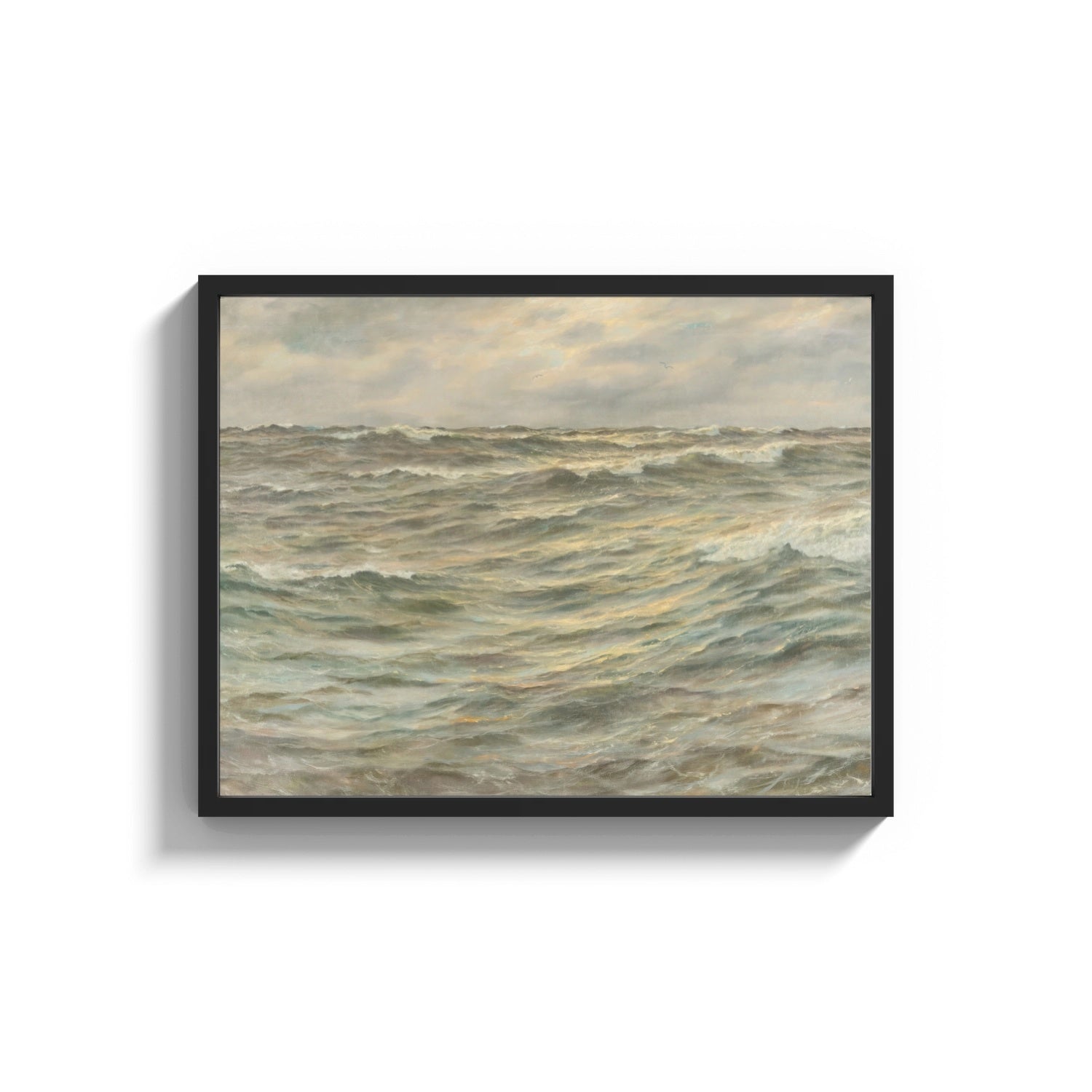 Framed stormy grey-green seascape with breaking waves vintage art print print shown as a wide statement piece on a clean…
