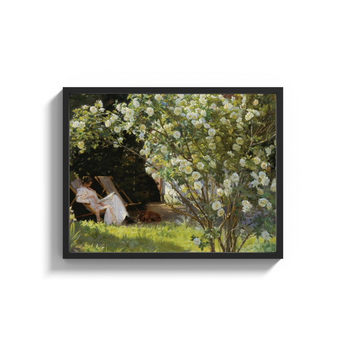 Framed woman reading under white roses with a sleeping dog vintage art print shown as a wide statement piece