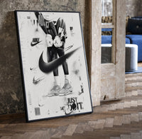 KAWS Companion Air Jordan Sneakers framed poster print in a black frame leaning beside a vintage door on parquet