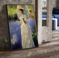 woman with a parasol beside a lily pond vintage art print print in a black frame leaning beside a vintage door on parquet