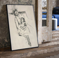 mother embracing seated daughter vintage art print print in a black frame leaning beside a vintage door on parquet