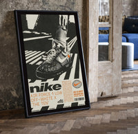 White Off-White Nike Air Force 1 framed poster print in a black frame leaning beside a vintage door on parquet