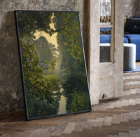 forest pond framed by overhanging branches vintage art print print in a black frame leaning beside a vintage door on parquet