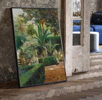 garden with palm trees and figures vintage art print print in a black frame leaning beside a vintage door on parquet