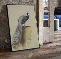 peacock with full tail perched on ledge vintage art print print in a black frame leaning beside a vintage door on parquet