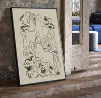 three horses vintage art print print in a black frame leaning beside a vintage door on parquet
