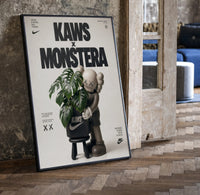 KAWS Companion Monstera Nike framed poster print in a black frame leaning beside a vintage door on parquet