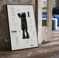 KAWS Companion Passing Through framed poster print in a black frame leaning beside a vintage door on parquet