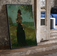 woman under a blossoming tree vintage art print print in a black frame leaning beside a vintage door on parquet