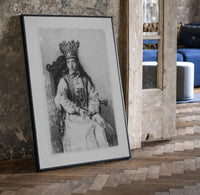 crowned queen seated portrait vintage art print print in a black frame leaning beside a vintage door on parquet