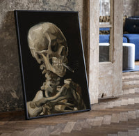 skeleton smoking a cigarette vintage art print print in a black frame leaning beside a vintage door on parquet