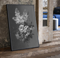 white lilac and roses bouquet vintage art print print in a black frame leaning beside a vintage door on parquet