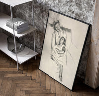 mother embracing seated daughter vintage art print poster in a black frame leaning beside a shelf in a raw-plaster loft