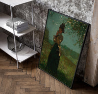woman under a blossoming tree vintage art print poster in a black frame leaning beside a shelf in a raw-plaster loft