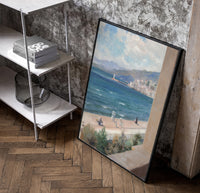 Mediterranean coastal promenade seen from balcony vintage art print poster in a black frame leaning beside a shelf in a…
