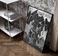 Travis Scott Utopia Album Cover framed poster poster in a black frame leaning beside a shelf in a raw-plaster loft