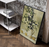 flowers and lemons still life vintage art print poster in a black frame leaning beside a shelf in a raw-plaster loft
